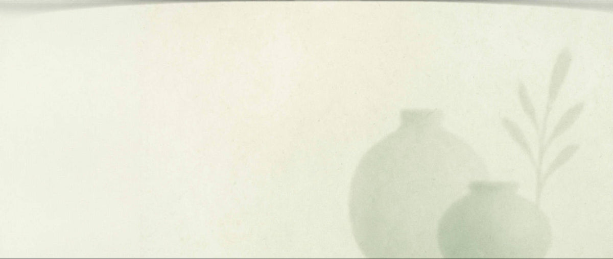 Light gray pear-shaped object on a white background